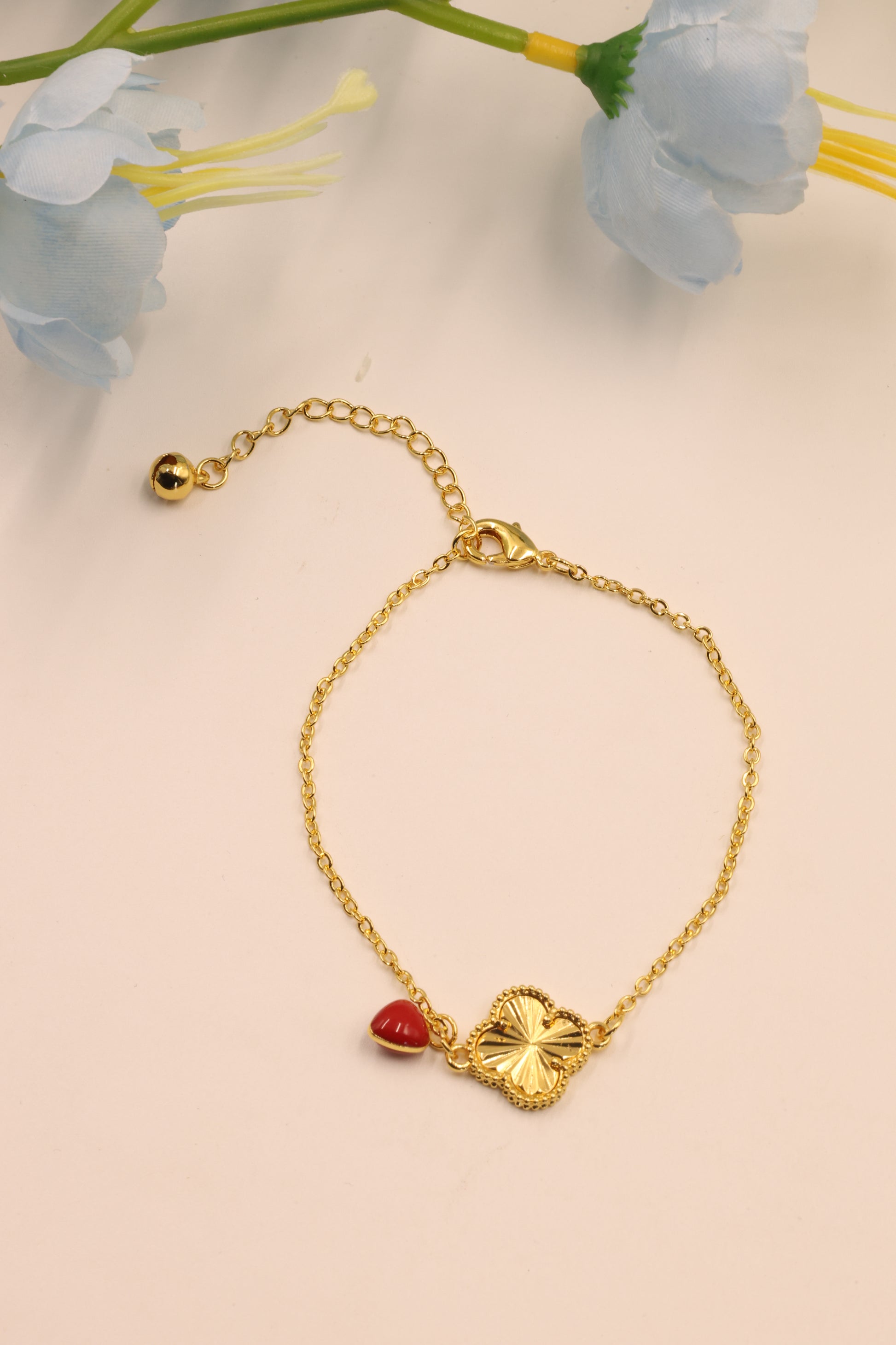 Golden Clover Link Bracelet with Red Charm Drop – Everyday Elegance Edition